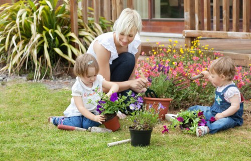 Gardener measuring a back garden for cubic yard estimate